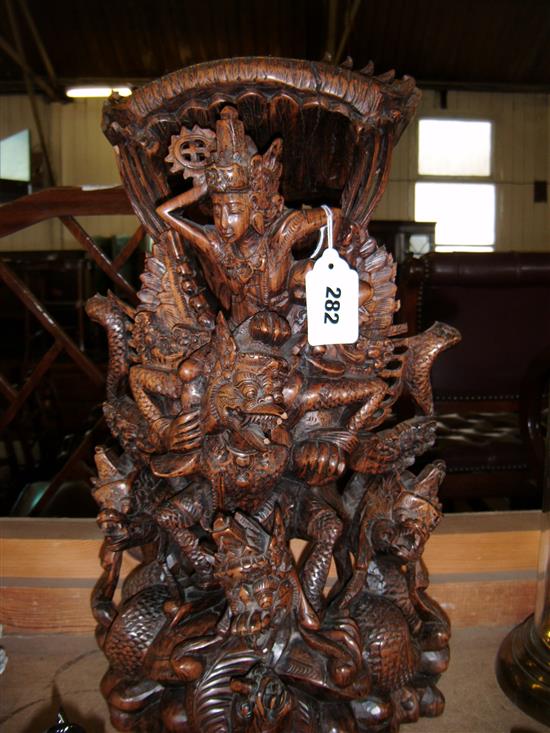 An unusual Balinese carved hardwood figural group